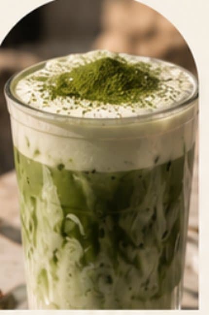Iced matcha latte dusted with matcha powder
